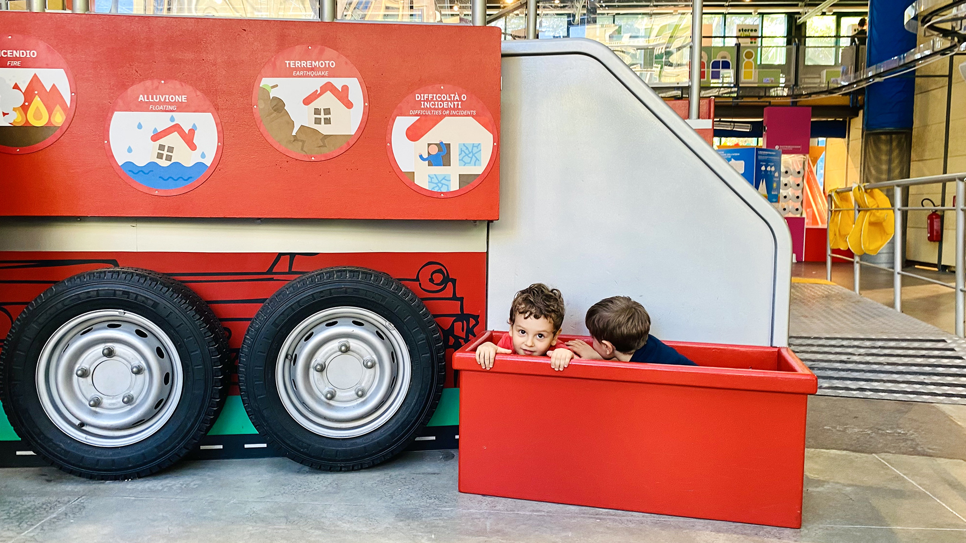 kids playing in a red box